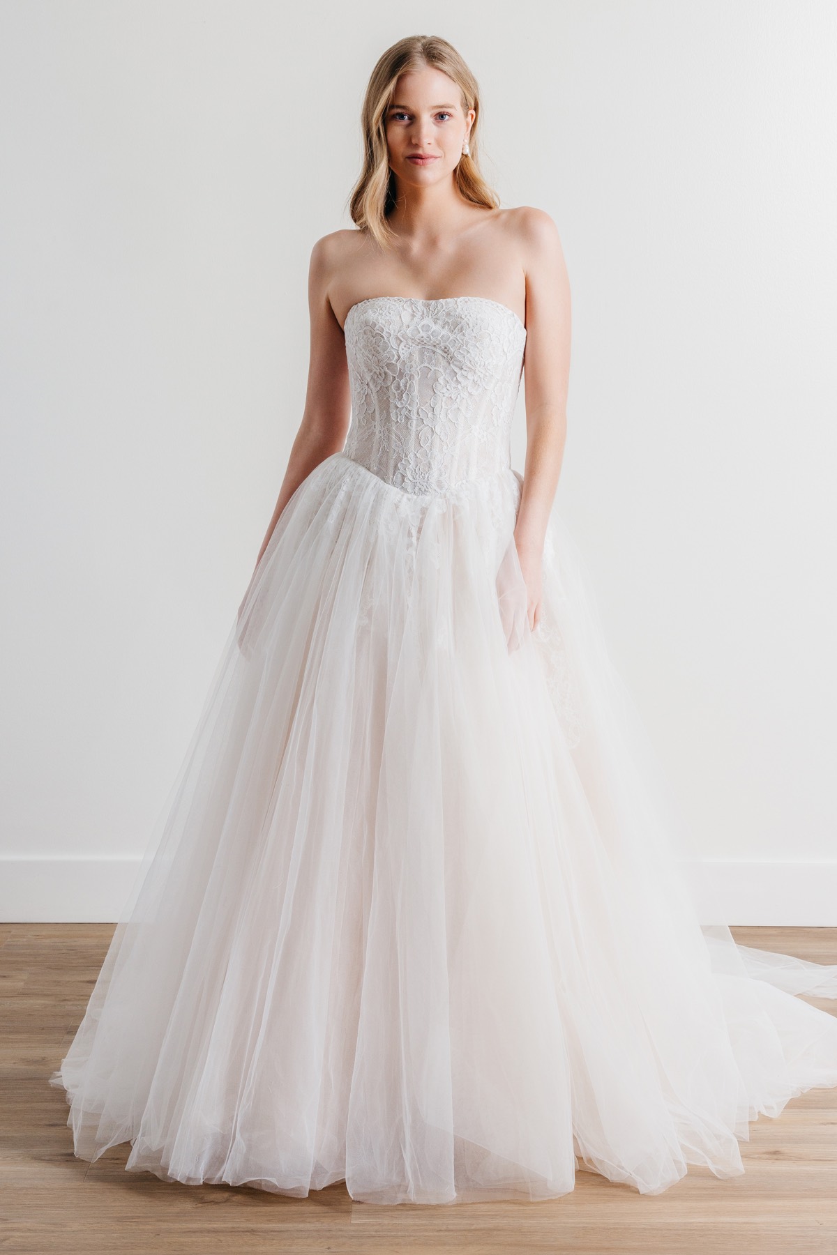 banded lace point d'esprit tulle wedding dress This is Style #1598 from Eve of Milady. It has a lace sleeveless bodice  with a tulle skirt